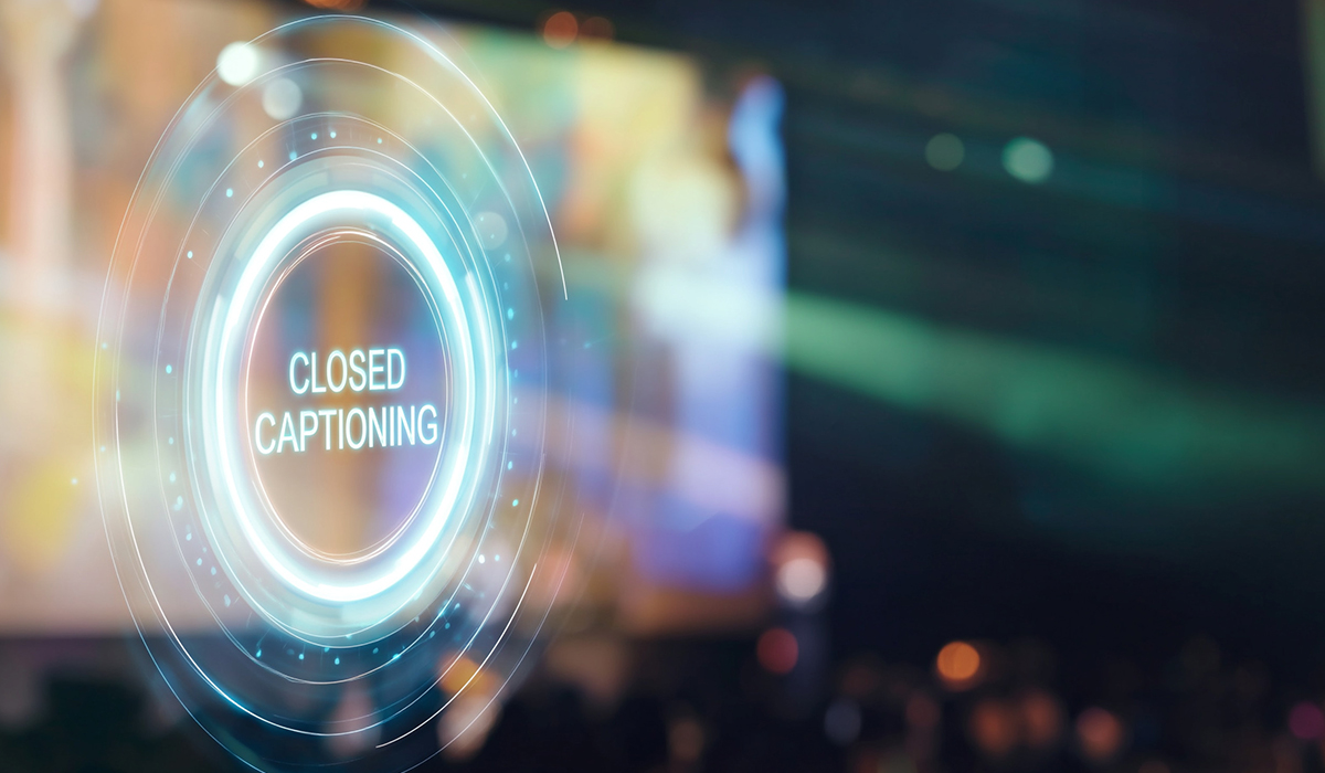 A glowing digital graphic featuring the words CLOSED CAPTIONING inside glowing neon circles against a blurred event background.